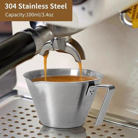 Two Pack Stainless Steel Espresso Cups With Handle And Double Spout Measuring Cup With Dual Scale 3.4 Oz 100 Ml V Shaped Mouth Durable Coffee Shot Glasses For Home Barista Vibe as espresso flows from machine into cup.