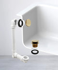 Slick Sch 40 Pvc Bathtub Waste Assembly With Illusion Overflow Plate And Tip Toe Drain Plug Polished Brass Finish installed in tub.