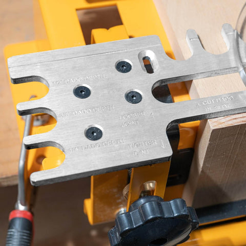 Close-up of a 12 Inch Dovetail Jig With Templates, Router Bits, And Guide Bushing for precise woodworking projects.