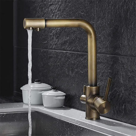 360-Degree Rotating Antique Bronze Kitchen Faucet Water Purifier 3-Way Dual Filter Tap with flowing water in kitchen setting.