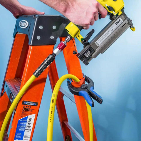 Medium Bandy Clamps Set For Woodworking With Easy Squeeze One Handed Operation attached to a ladder holding a hose.