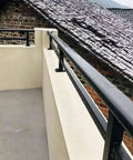 Heavy Duty Outdoor Privacy Fence Extension Frame With Flat Railing Guardrail Kit on patio, showcasing black galvanized steel material and height.