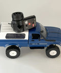 Blue All Terrain 1/16 Scale RC Rock Crawler 4x4 Ready To Run Pickup Truck With remote control on top, dual batteries visible