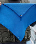 Person holding blue microfiber towel with waffle pattern, Grab And Go Clip On Microfiber Fishing Towels With Waffle Pattern, Quick Dry.