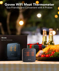 WiFi Meat Thermometer With 4 Probes displayed next to its packaging on a table with a roasted chicken and decorations in the background.