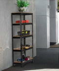 Five Tier Boltless Adjustable Steel Storage Shelf Unit Black in garage, sturdy frame, loaded with tools and plant on top