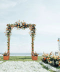 Wooden Garden Arbor With Planter Boxes And Wedding Arch For Outdoor Ceremony, Trellis For Climbing Plants, Easy Setup Pergola For Backyard Or Lawn, Durable Fir Wood In Golden Brown Finish in garden setting with floral decorations.
