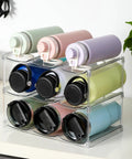 Stackable Water Bottle Organizer Holder For Large Tumblers Fits Big Bottles Three Tier Clear Wine Rack Style Cup Holder For Cabinet Countertop Fridge Pantry Holds Nine showcasing assorted tumblers.