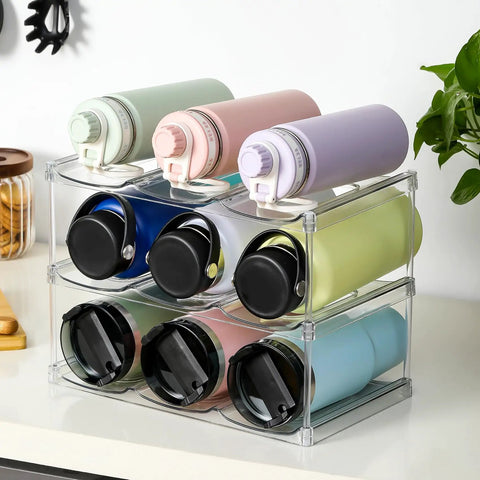 Stackable Water Bottle Organizer Holder For Large Tumblers Fits Big Bottles Three Tier Clear Wine Rack Style Cup Holder For Cabinet Countertop Fridge Pantry Holds Nine showcasing assorted tumblers.