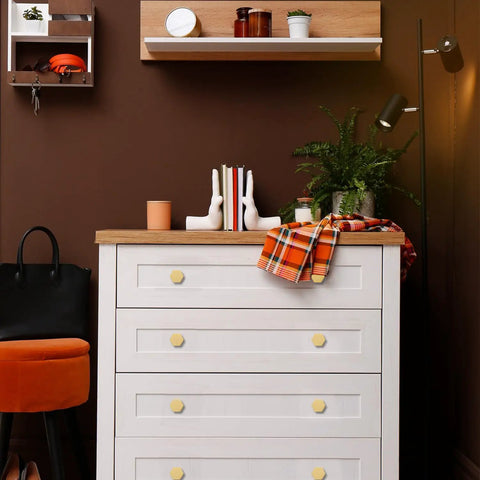 White dresser with 1-1/10 Inch Solid Brass Knob And Pull Set For Cabinets And Drawers, Brushed Gold Hexagon Handles in bedroom.