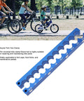 Must-Have Bicycle Fork Hub Clamp With CNC Milled Aluminum Alloy Axle Spindle Vise Insert For Precise Bike Repair, Maintenance, And Wheel Adjustments In Your Home Workshop Or Local Bike Park. Blue bike fork hub clamp tool featuring multiple size slots for maintenance.