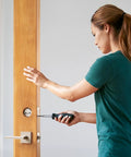 Woman installing Hella Sturdy Solid Brass Smart Deadbolt With Slick Bluetooth Plus WiFi Enabled Keyless Entry Digital Door Lock.
