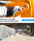 Grease gun coupler with blue hose and double-handle quick-release nozzle attached to a lubrication fitting.