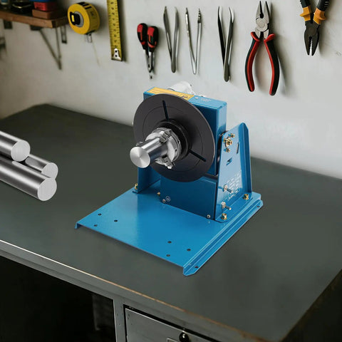 Smooth Operator Heavy Duty Cast Iron Tabletop Welding Positioner With Adjustable Speed Rotation And Lockable Tilt Features For Daily Metal Fab Projects on a workbench.