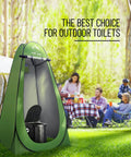 Go To Portable Camping Toilet Kit with Pop Up Privacy Tent in green, shown in an outdoor setting with people in the background.