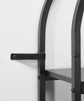 Close-up of Rustic Vintage 4-Tier Arched Metal Storage Bookcase detailing metal frame and wall strap for stability.