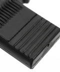 Close-up of black push on quick fitting furniture panel clip surface texture from 12 pcs one hand connectors set