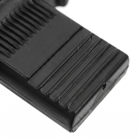 Close-up of black push on quick fitting furniture panel clip surface texture from 12 pcs one hand connectors set