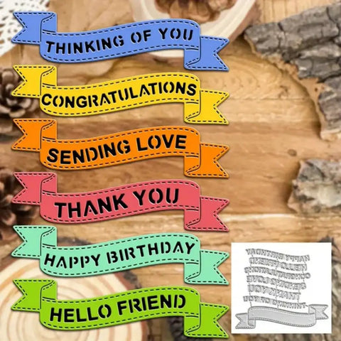 Colorful banner die cuts in various colors with text on wooden background, from Layered Net Frame Scrapbooking Die Cuts Set For Card Making And Paper Craft.