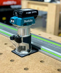 Killer Precision Router Guide Rail Adapter For Makita Tools installed on track for precise woodworking cuts.