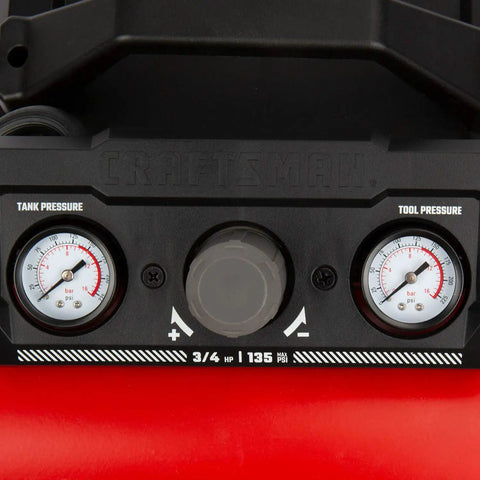 Close-up of gauges on Compact 1.5 Gallon Oil Free Portable Air Compressor, showing tank and tool pressure readings.