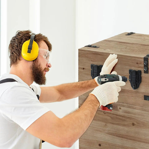 Person installing 4 Pack Black Toggle Hasp Latch Hardware With Screws on a wooden box using a drill, wearing safety gear.