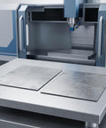 Top Shelf Stainless Steel Square Sheets 2 Pack 15X15X0.08Cm on a milling machine table for precision cuts.