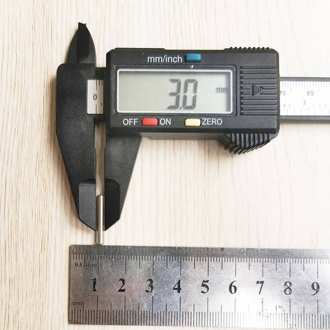 Close-up of caliper measuring 3mm, used for 100 Pieces 3mm x 18mm Stainless Steel Dowel Pins For Shelf Support And Cabinet Fastening Rust Resistant Dowel Pins With Centerless Ground Finish Heavy Duty Metal Fasteners For DIY Projects.