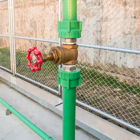 Shutoff Handle Set With Low Flow Resistance Cast Iron Ball Hand Wheels Flat Bottom Design Red Decorative Handles For Valve Replacement And Water Fittings 10 Pack installed on a green pipe.