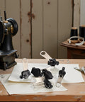 6 Piece Black Universal Zipper Repair Kit With Quick Fix Sliders For No Tool Needed Replacement on sewing table