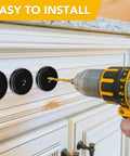 Person installing Neodymium Cup Magnets With Countersunk Holes And Stainless Screws, Heavy Duty Holding Up To 110 Lbs Per Magnet, Black Pack Of 12 on cabinet