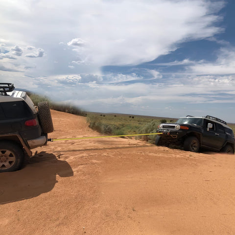 Off-road recovery of a stuck Jeep using a 2 Inch Shackle Hitch Receiver Set With Three Quarter Inch D Ring, 45000 Lb Break Strength.