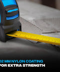 Close-up of Rugged 25 Ft Tape Measure with Nylon Coated 1.25 Inch Blade, Dual Magnet Hook on wooden surface.