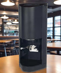 Automatic Espresso Tamper With Smart Digital Screen, 58 Mm Stainless Steel Coffee Press on a wooden table.