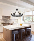 Six Light Farmhouse Wagon Wheel Chandelier for Dining Room and Kitchen Island Pendant Lights in modern black rustic metal.