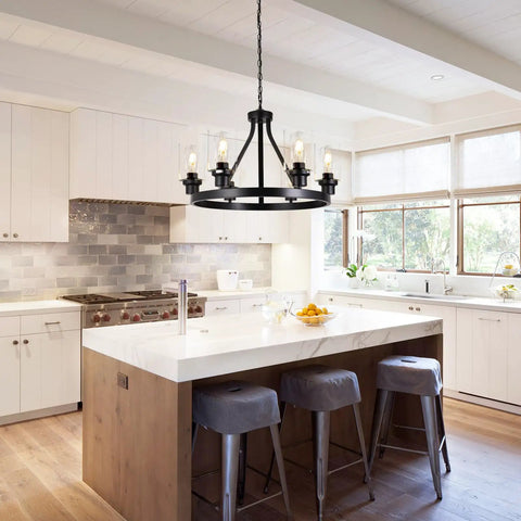 Six Light Farmhouse Wagon Wheel Chandelier for Dining Room and Kitchen Island Pendant Lights in modern black rustic metal.