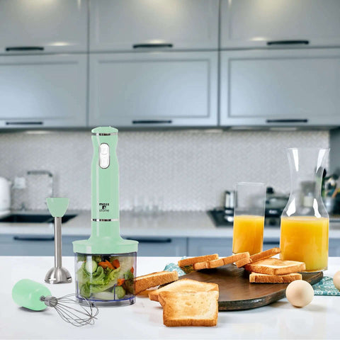 Real Talk Kickin Electric Hand Blender With Egg Whisk And Food Chopper 300 Watt Stick Mixer on kitchen counter with food.