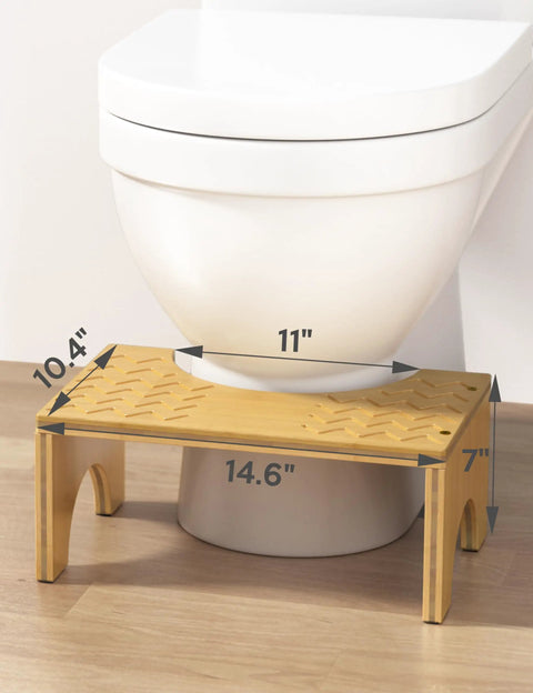 Bamboo Poop Stool 7 Inch Toilet Step For Easy Pooping And Squatting in front of white toilet, wood bathroom foot stool, anti slip layer.