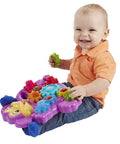 Toddler playing with Totally Awesome Dope Monkey Gears Stacking And Spinning Toy With Nine Interchangeable Plastic Cogs.