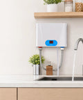 Heavy Duty Electric Tankless Water Heater Pumps Out Straight Up Instant Hot Water On Demand with a Sleek Digital Display and 5500 Watt Heating Element for Reliability You Can Count On in Your Kitchen or Bath Setup mounted under sink with running water.