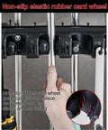 Close-up of Mop And Broom Holder Heavy Duty Stainless Steel Tool Rack with rubber wheels in use.