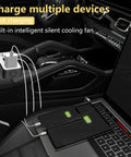 200W Car Power Inverter With Dual 110V AC Outlets And Four USB Ports Including 20W USB-C Fast Charge And 18W Quick Charge For Laptops Tablets And Phones, Road Trip Ready On The Go Car Charger in use in a vehicle interior with multiple devices connected