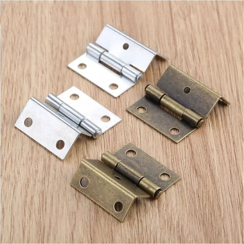 Dope Zinc Alloy Cabinet Hinges Set with Antique Bronze and Silver Finish showing 4 decorative hinges on a wood surface