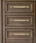 Ten Pack 5 Inch Satin Brass Cabinet Pulls Heavy Duty Brushed Brass Handles on wooden drawer in kitchen