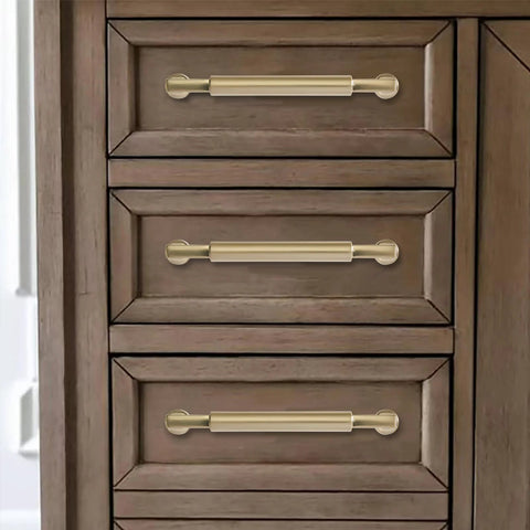 Ten Pack 5 Inch Satin Brass Cabinet Pulls Heavy Duty Brushed Brass Handles on wooden drawer in kitchen