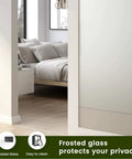 Frosted Glass Bifold The Doors pre-finished sliding MDF white interior door shown partly open in a bedroom setting with privacy.