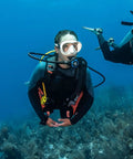Diver using Compact Scuba Octopus Regulator For Easy, No Fuss Diving, Ultra Lightweight, yellow hose visible underwater