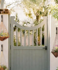 Outdoor gate with hanging planters on heavy duty wall mount coat hooks set of 4, each holds up to 30 lbs, rust resistant black finish.