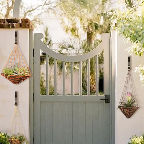 Outdoor gate with hanging planters on heavy duty wall mount coat hooks set of 4, each holds up to 30 lbs, rust resistant black finish.