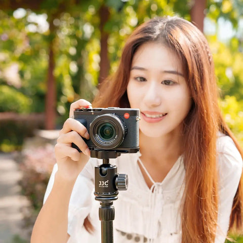 Woman using camera with Durable Aluminum Hand Grip For D-LUX8 Camera With L Shape Bracket And Built In Arca Quick Release Plate outdoors